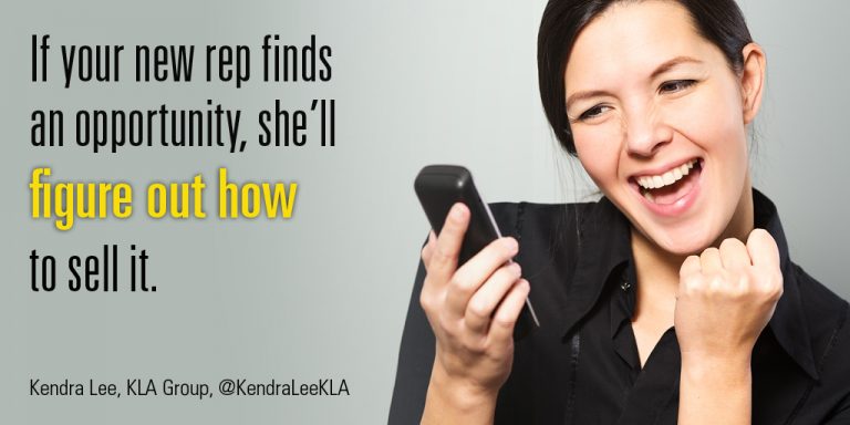 Woman salesperson looking at her cell phone, smiling and doing a fist pump